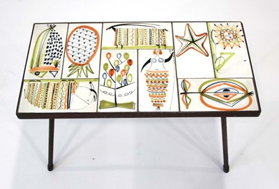Lot 59 - A 1950/60's occasional table, the surface set...