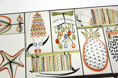 Lot 59 - A 1950/60's occasional table, the surface set...