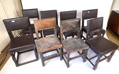 Lot 102 - A group of nine oak and leather upholstered...