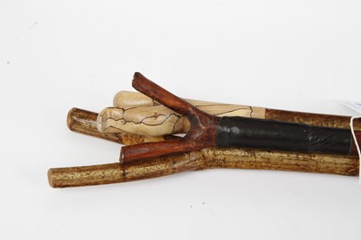 Lot 1038 - Three various thumb sticks
