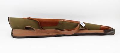 Lot 1303 - Two fleece-lined canvas and leather gun slips,...