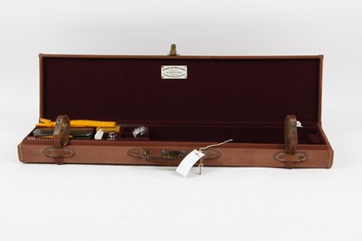 Lot 1451 - Canvas shotgun case, with cleaning equipment...