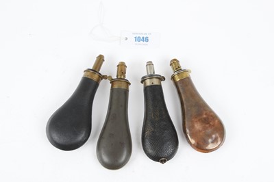 Lot 1046 - Three powder flasks by Bartram & Co., and one...