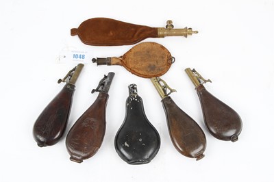 Lot 1048 - Seven various shot flasks inc. one by Sykes