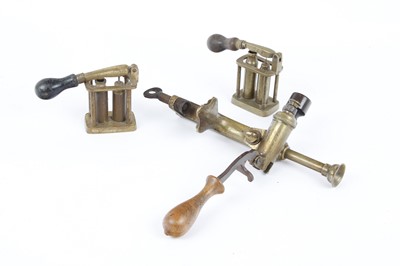 Lot 2352 - Brass 12 bore roll turnover and two decappers