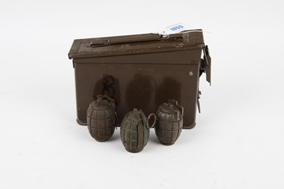 Lot 1055 - Three inert pineapple grenades in ammunition tin