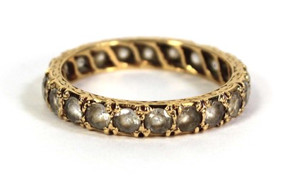 Lot 506 - A yellow metal full eternity ring set paste,...