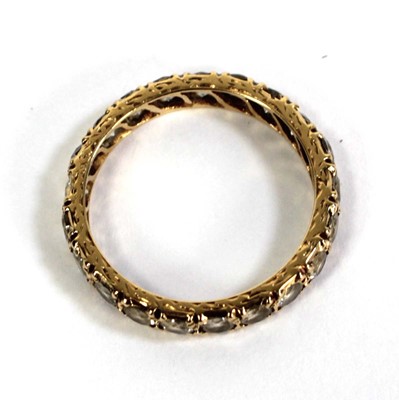Lot 506 - A yellow metal full eternity ring set paste,...
