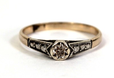 Lot 510 - A 9ct yellow gold ring set small diamond in an...