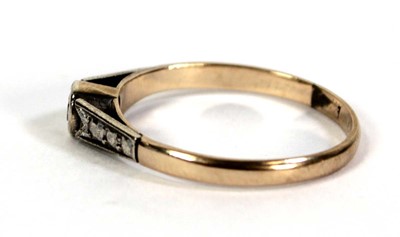 Lot 510 - A 9ct yellow gold ring set small diamond in an...