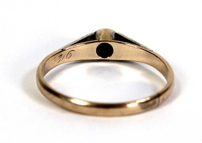 Lot 510 - A 9ct yellow gold ring set small diamond in an...