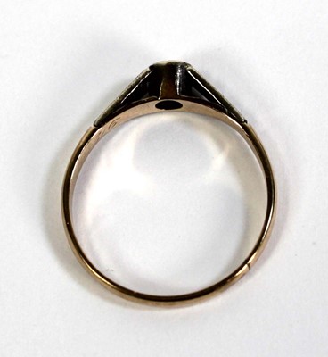 Lot 510 - A 9ct yellow gold ring set small diamond in an...