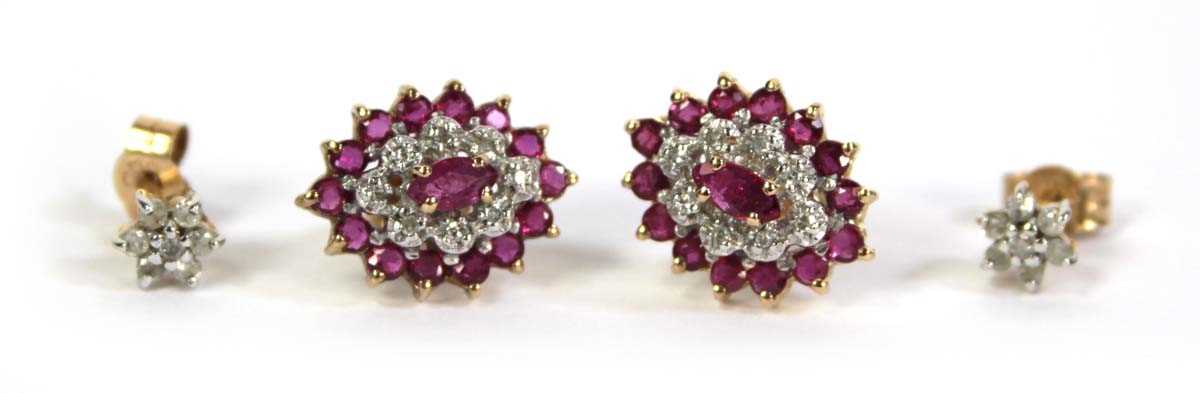Lot 512 - A pair of 9ct yellow gold ear studs, each set...