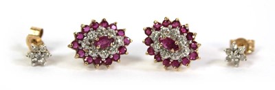 Lot 512 - A pair of 9ct yellow gold ear studs, each set...