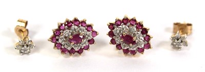 Lot 512 - A pair of 9ct yellow gold ear studs, each set...