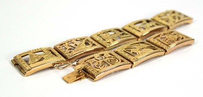 Lot 515 - An Egyptian yellow metal eight section...