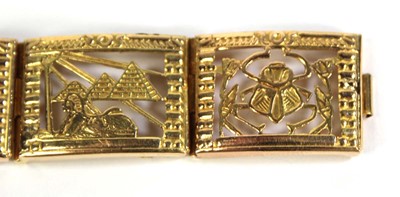 Lot 515 - An Egyptian yellow metal eight section...