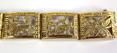 Lot 515 - An Egyptian yellow metal eight section...