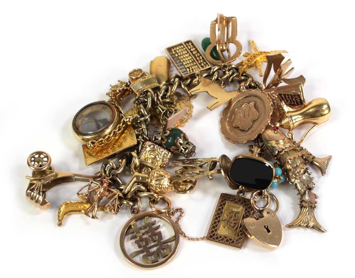Lot 516 - A 9ct yellow gold curblink bracelet with 9ct...