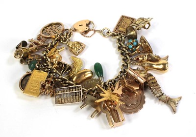 Lot 516 - A 9ct yellow gold curblink bracelet with 9ct...