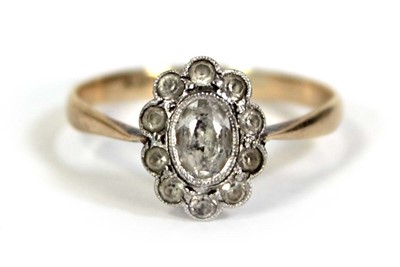 Lot 520 - A 9ct yellow gold cluster ring set paste...